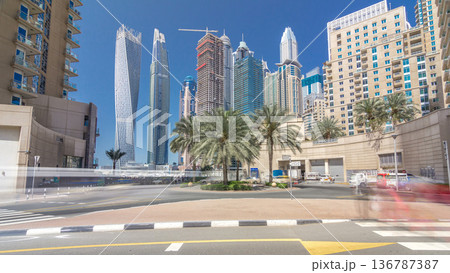 Panoramic view with modern skyscrapers and yachts of Dubai Marina timelapse hyperlapse, United Arab Emirates 136787387