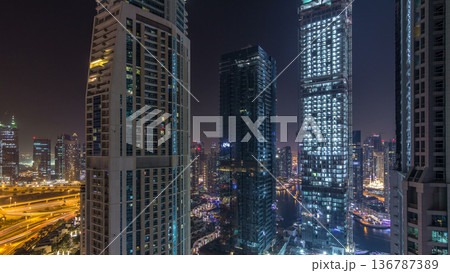 Water canal on Dubai Marina skyline at night timelapse. 136787389