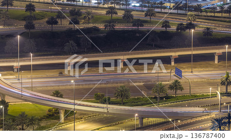 Aerial view of a road intersection in a big city night timelapse. 136787400