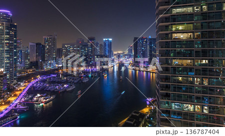 Water canal on Dubai Marina skyline at night timelapse. Water canal on Dubai Marina skyline at night timelapse. 136787404