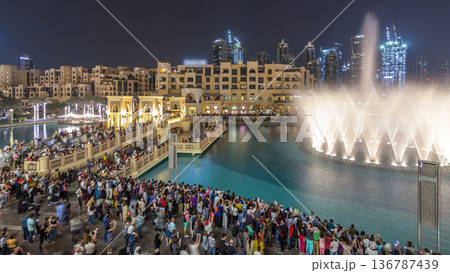 The bridge near the biggest musical fountain in Dubai night timelapse. Dubai, UAE 136787439