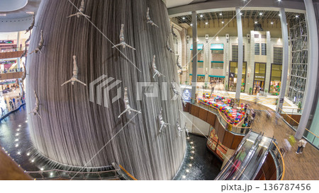 Giant Fountain with Flying Sculpture of an Diver timelapse in Dubai Mall. 136787456