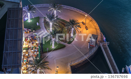 Modern embankment timelapse with bar, Cafe and Restaurant in famous Dubai Marina. Modern embankment timelapse with bar, Cafe and Restaurant in famous Dubai Marina. 136787698