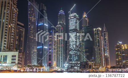 Dubai marina bay with yachts an boats night timelapse Dubai marina bay with yachts an boats night timelapse 136787722
