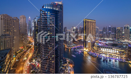Evening illumination of Dubai Marina day to night aerial timelapse, UAE. 136787725