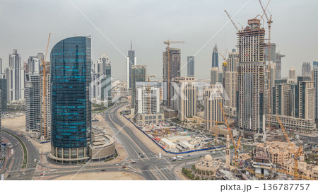 Downtown Dubai and business bay skyline with residential towers timelapse, view from rooftop. Downtown Dubai and business bay skyline with residential towers timelapse, view from rooftop. 136787757