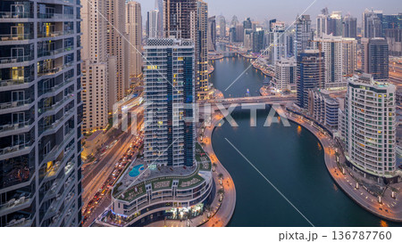 Beautiful aerial top view day to night transition timelapse of Dubai Marina canal Beautiful aerial top view day to night transition timelapse of Dubai Marina canal 136787760
