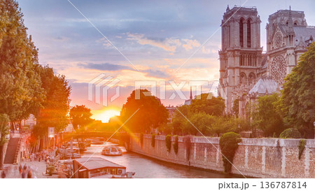Sunset view of Cathedral Notre Dame de Paris timelapse in Paris, France. 136787814