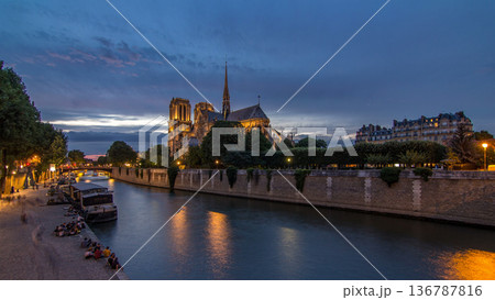 Cathedral Notre Dame de Paris day to night timelapse after sunset in Paris, France. Cathedral Notre Dame de Paris day to night timelapse after sunset in Paris, France. 136787816