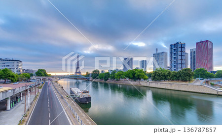 Eiffel Tower sunrise timelapse with boats on Seine river and in Paris, France. 136787857