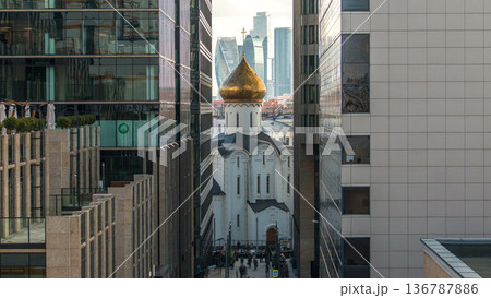 Temple of St. Nicholas timelapse in Tverskaya Zastava between office buildings in Moscow, Russia Temple of St. Nicholas timelapse in Tverskaya Zastava between office buildings in Moscow, Russia 136787886