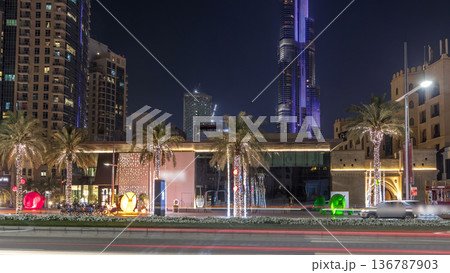 Street view of Dubai skyline timelapse and rush hour traffic in downtown at night 136787903