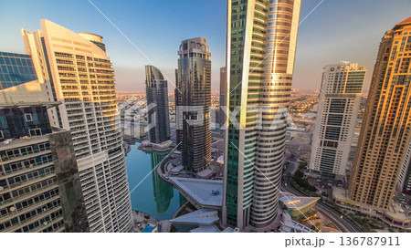 Top view of buildings Jumeirah Lakes Towers with traffic on the road sunset timelapse. Top view of buildings Jumeirah Lakes Towers with traffic on the road sunset timelapse. 136787911