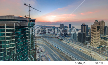 Sunset aerial top view timelapse at Dubai Marina and JLT in Dubai, UAE Sunset aerial top view timelapse at Dubai Marina and JLT in Dubai, UAE 136787912