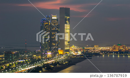 Top view of famous towers buildings in Abu Dhabi day to night timelapse. Top view of famous towers buildings in Abu Dhabi day to night timelapse. 136787919