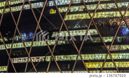 Window of the multi-storey building of glass and steel lighting timelapse Window of the multi-storey building of glass and steel lighting timelapse 136787920