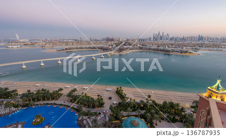 Jumeirah Palm island skyline day to night timelapse in Dubai, UAE. Jumeirah Palm island skyline day to night timelapse in Dubai, UAE. 136787935