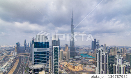 Panoramic skyline of Dubai timelapse, United Arab Emirates. View of world famous skyscrapers. Panoramic skyline of Dubai timelapse, United Arab Emirates. View of world famous skyscrapers. 136787982