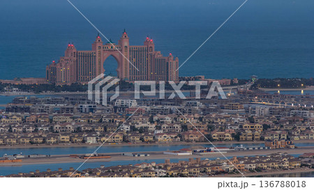 Jumeirah Palm Island night to day timelapse dubai shot from the rooftop top of the tower in dubai marina, uae Jumeirah Palm Island night to day timelapse dubai shot from the rooftop top of the tower in dubai marina, uae 136788018