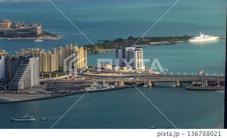 Jumeirah Palm Island morning timelapse dubai shot from the rooftop top of the tower in dubai marina, uae 136788021