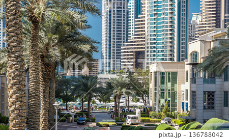 Fountain and palms timelapse at the Marina walk during day time. Dubai, UAE 136788042