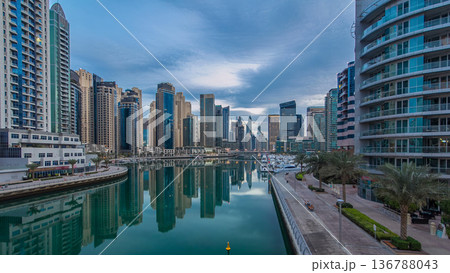 Dubai Marina towers and canal in Dubai night to day timelapse Dubai Marina towers and canal in Dubai night to day timelapse 136788043