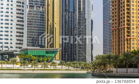 Residential buildings in Jumeirah Lake Towers timelapse in Dubai, UAE. Residential buildings in Jumeirah Lake Towers timelapse in Dubai, UAE. 136788054