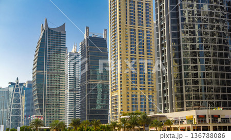 Residential buildings in Jumeirah Lake Towers timelapse in Dubai, UAE. 136788086