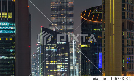 Dubai downtown architecture at night timelapse. Aerial view of numerous skyscrapers near Sheikh Zayed road. 136788106