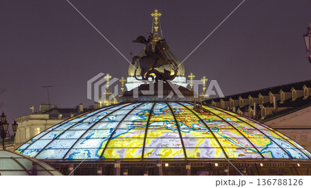 Glass cupola crowned by a statue of Saint George, patron of Moscow, at the Manege Square timelapse in Moscow, Russia 136788126