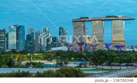 Marina Bay Sands, Gardens by the bay with cloud forest, flower dome and supertrees night to day timelapse before sunrise Marina Bay Sands, Gardens by the bay with cloud forest, flower dome and supertrees night to day timelapse before sunrise 136788346