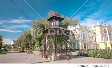 Beautiful park with clock on pavilion in the center of Uralsk timelapse hyperlapse. Western Kazakhstan. Beautiful park with clock on pavilion in the center of Uralsk timelapse hyperlapse. Western Kazakhstan. 136788385