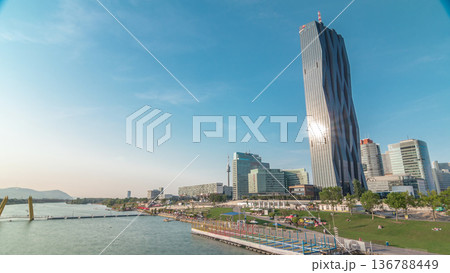 Donaustadt Danube City timelapse hyperlapse is a modern quarter with skyscrapers and business centres in Vienna, Austria. Donaustadt Danube City timelapse hyperlapse is a modern quarter with skyscrapers and business centres in Vienna, Austria. 136788449