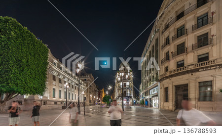 Illuminated Adriatica building on Avenida de la Constitucion at night, Seville, Spain 136788593