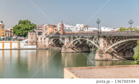 Puente de Isabel II bridge timelapse hyperlapse over the Guadalquivir River, Seville, Spain 136788594
