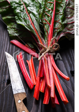 Fresh Swiss chard bunch with red stems Fresh Swiss chard bunch with red stems 136788827