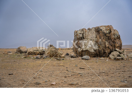 Ancient megalith near Kosh-Agach Altai Russia. Historic stone monument in remote Siberian mountain landscape. Place of power Ancient megalith near Kosh-Agach Altai Russia. Historic stone monument in remote Siberian mountain landscape. Place of power 136791053