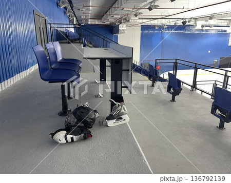 hockey helmet with guard and skates in the ice stadium before game 136792139