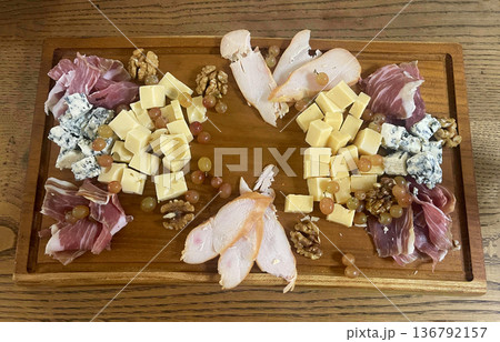 a wooden antipasti board on the table a wooden antipasti board on the table 136792157