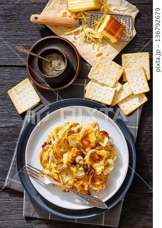 Baked French onion gratin on a plate 136792679