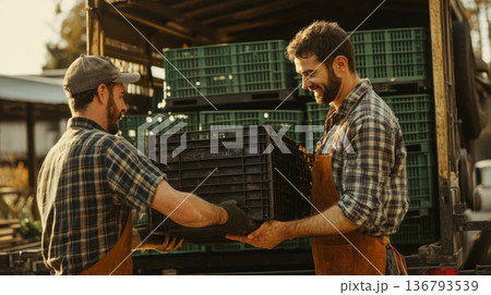 Farmers Loading Crates on a Rustic Farm 136793539