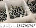 Close up of metal screws in plastic organizer compartment hardware background 136793797