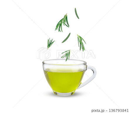Fresh rosemary leaves sprinkled into rosemary tea, aromatic herbal drink with natural health benefits and refreshing scent   white background. 136793841