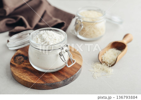 Rice flour in glass jar with raw Rice flour in glass jar with raw 136793884