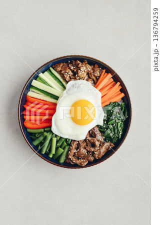 Bibimbap on a concrete background Bibimbap on a concrete background 136794259