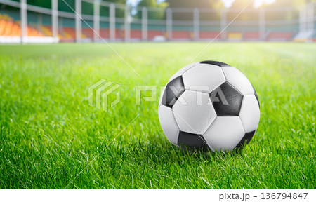 football field and ball ready for exciting match football field and ball ready for exciting match 136794847