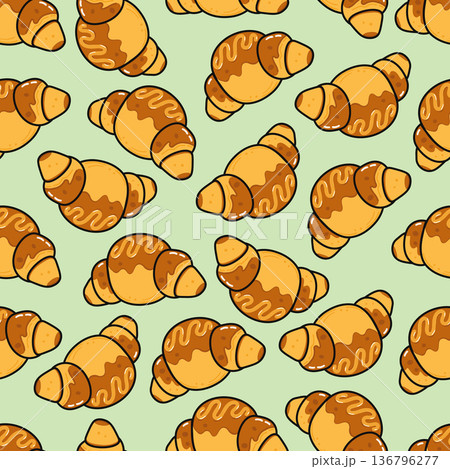 Croissants pattern with sweet glaze on green background 136796277