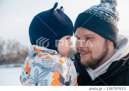Father and Child Bonding in Winter Clothing 136797633