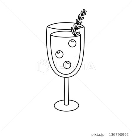 A glass of wine with berries on top 136798992