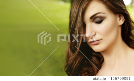 Serene Outdoor Portrait. Gentlelit Outdoor Scene Featuring Reflective Woman With Smoky Eye Makeup. Tranquil Image Of Serene Woman With Muted Green Background And Delicate Facial Highlights Serene Outdoor Portrait. Gentlelit Outdoor Scene Featuring Reflective Woman With Smoky Eye Makeup. Tranquil Image Of Serene Woman With Muted Green Background And Delicate Facial Highlights 136799091